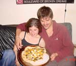 Sarah and Jordan with their hot-off-the-oven pizza