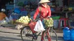 peach vendor on a bicycle