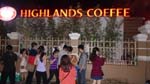 genius! this coffee guy put up his ad-hoc coffee stand below the huge sign of Highlands Coffee