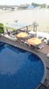 balcony view - swimming pool,  outdoor resto seating and the Chao Phraya River