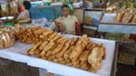 Banh Mi guy at Kampot Market, a long baguette is $.25