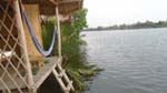 cottages of Eden Eco Village are on stilts by the Kampot River