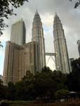 the imposing presence of the Petronas Twin Towers as viewed from KLCC Park
