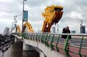 crossing a dragon-themed bridge in Da Nang