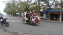 a vendor on motorbike...looking like a Christmas tree