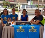 at the event booth with the lovely yoginis of Surya Nanda Yoga Studio 