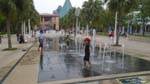 kids frolicking on a dancing water fountain