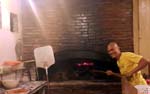 messing around Neva's Pizza's brick oven