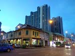 heritage shophouses with modern buildings in the background