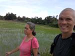 walking with Tilek towards her resort, passing through lush rice paddies