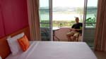 my cozy room at Green River Hotel with balcony overlooking the Mekong River