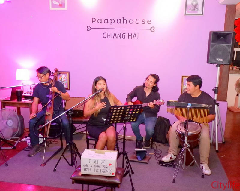 Ana on vocals, Geng on cello, and the band